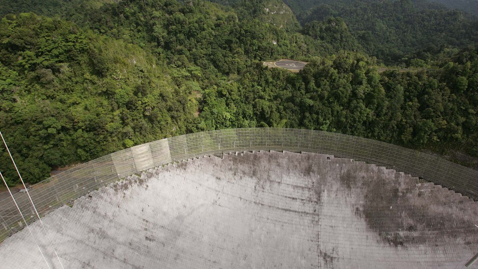 An aerial of the dish at the Arecibo Observatory in Puerto Rico