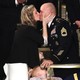 Amy Williams and Army Sgt. 1st Class Townsend Williams kiss at the State of the Union address