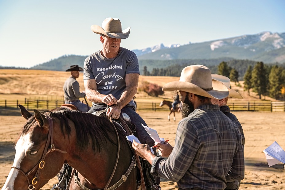 Taylor Sheridan on a horse with fellow actors reading scripts.