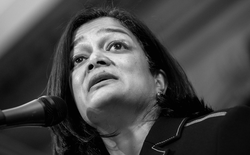 Representative Pramila Jayapal speaks into a microphone