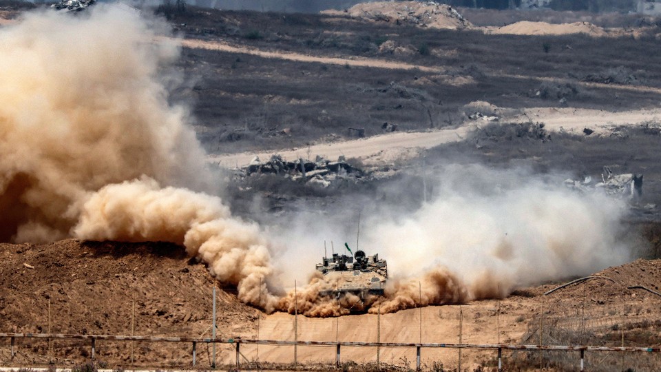 An Israeli army infantry-fighting vehicle (IFV) leaves a cloud of dust as it moves at a position along Israel's southern border with the Gaza Strip on August 5, 2025. Israel's Prime Minister Benjamin Netanyahu on August 5 prepared to unveil an updated Gaza war plan designed to destroy Hamas and secure the release of dozens of hostages, with Israeli media reporting he would order the total occupation of the Palestinian territory.