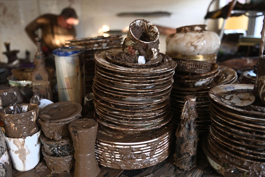 Muddied dishes are pictured in a house.