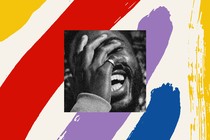 Man laughing with hand over face