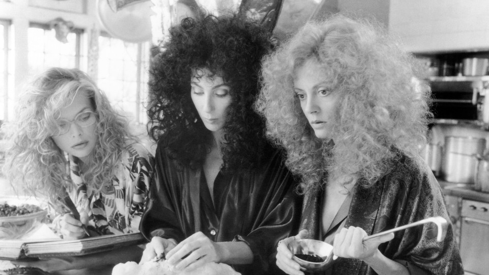 Michelle Pfeiffer, Cher, and Susan Sarandon in George Miller's <i>The Witches of Eastwick</i>, which is alternately uproarious, sexy, and deeply gross