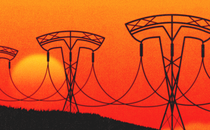 A series of electrical transmission line towers in the shape of Tesla's logo against an orange sky