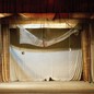 An image of an empty stage at a theatre
