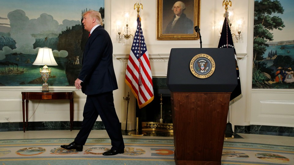 Donald Trump walks away from his podium. 