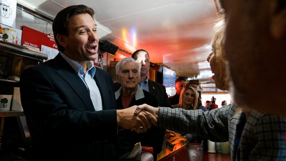 Ron DeSantis greets people at the Red Arrow Diner in Manchester, New Hampshire
