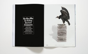 photo of magazine open to McKay Coppins's story "The Men Who Are Killing America's Newspapers" with vulture standing on stack of newspapers
