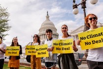 Members of Sunrise Movement stand in front of the Capitol during a press conference.