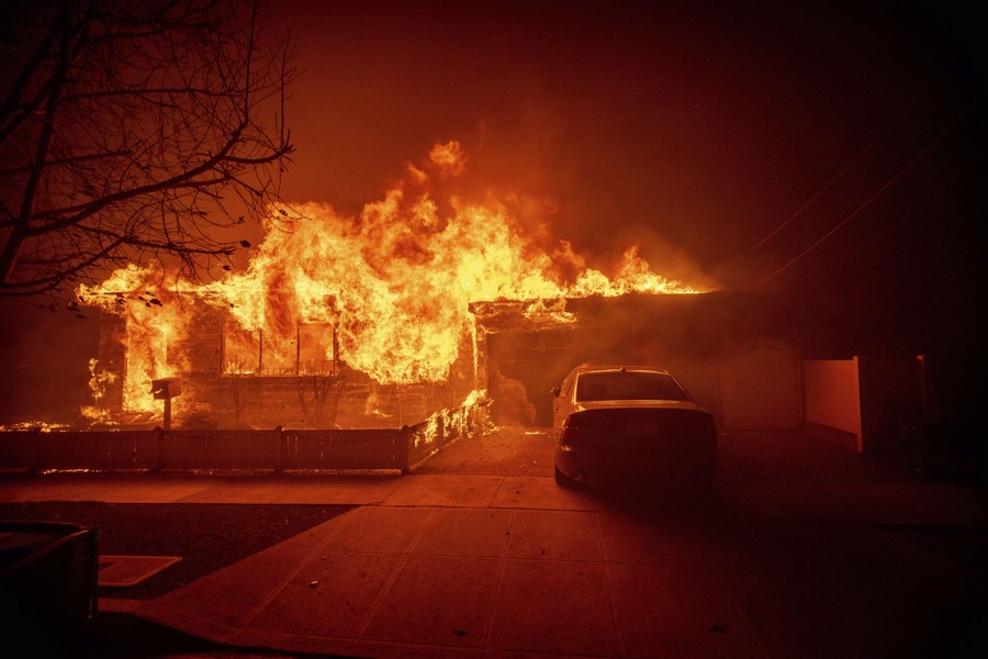 A house is engulfed in flames.