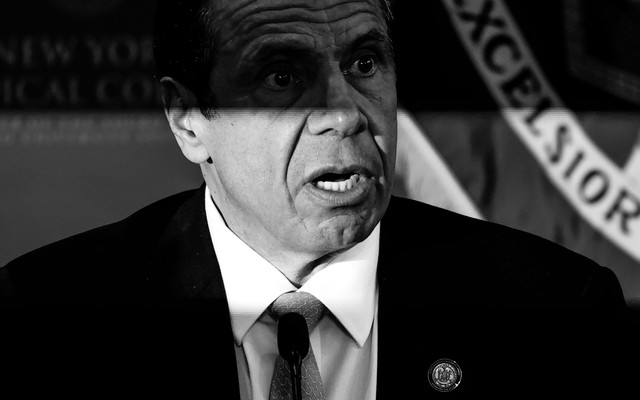 A black and white photo of Andrew Cuomo, looking surprised