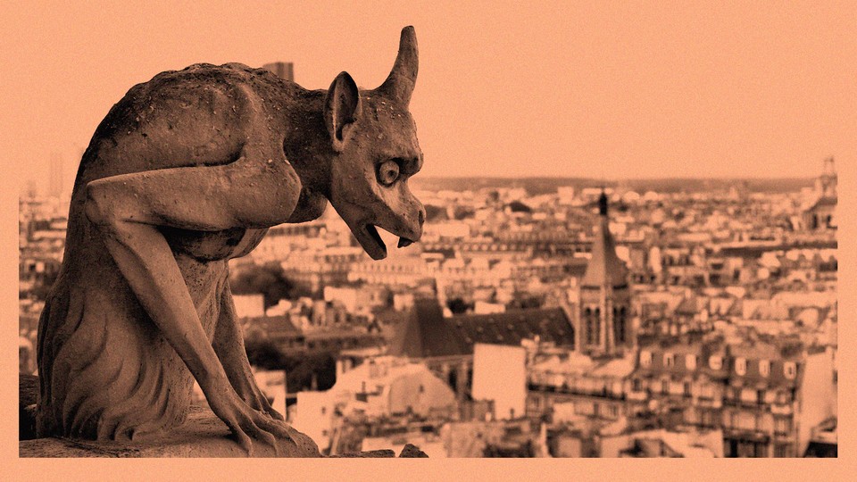 A photograph of a gargoyle overlooking Paris