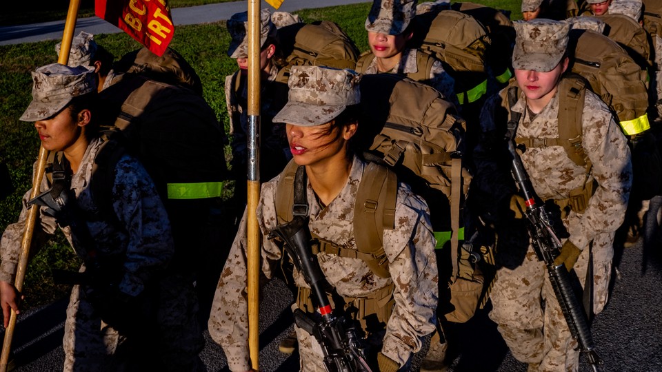 Photo of female U.S. marines completing a field exercise