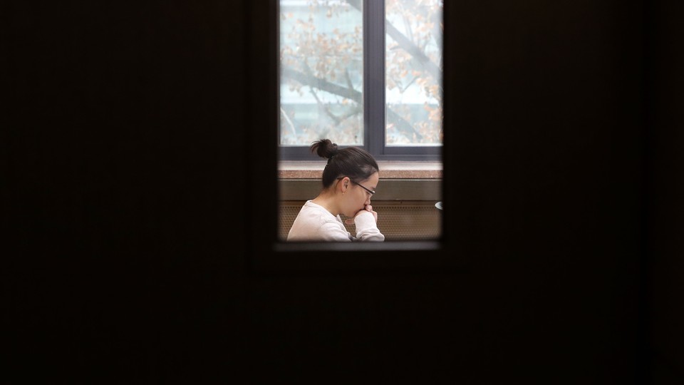 A South Korean student takes her College Scholastic Ability Test at a school on November 17, 2016, in Seoul, South Korea.