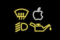 Four car infotainment symbols, including the Apple logo, against a black background