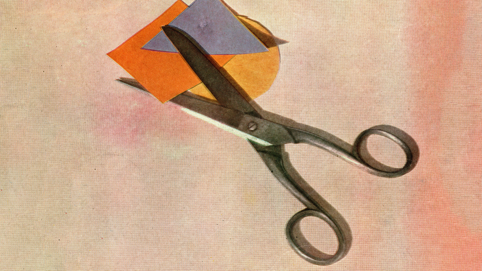 Scissors cutting paper