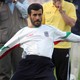 Mahmoud Ahmadinejad practices the other kind of football with the Iranian national team in 2006