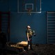 Ukrainian police officer standing in an empty gym