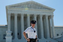 A police officer stands outside the U.S. Supreme Court building