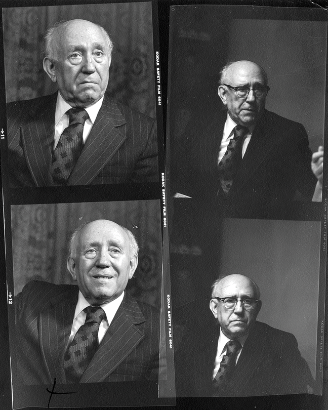 Contact-sheet proofs of three different black-and-white photos of white-haired balding man in pinstriped suit, white shirt, and tie.