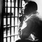 2 photos: King mug shot, 1956; King in jail, 1967
