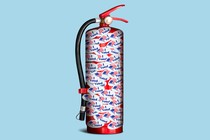 An illustration of a fire extinguisher covered in "I Voted" stickers