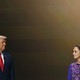 Donald Trump and Claudia Sheinbaum stand apart and look in each other's direction