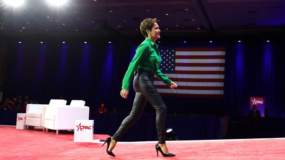 Kari Lake leaves after speaking at the annual Conservative Political Action Conference.