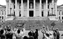 A black-and-white photograph of abortion-rights supporters protesting outside the Kansas statehouse in Topeka