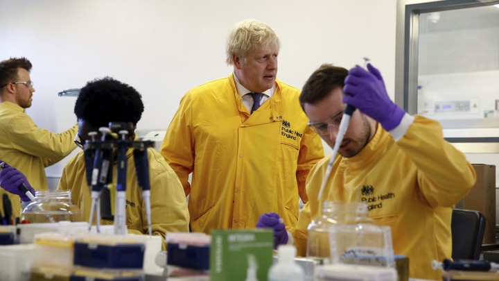 Britain's Prime Minister Boris Johnson visits a laboratory at the Public Health England National Infection Service.