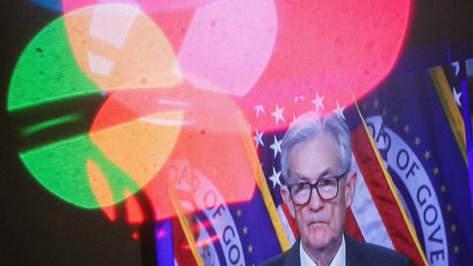 An image of Fed Reserve Chair Jerome Powell speaking on TV