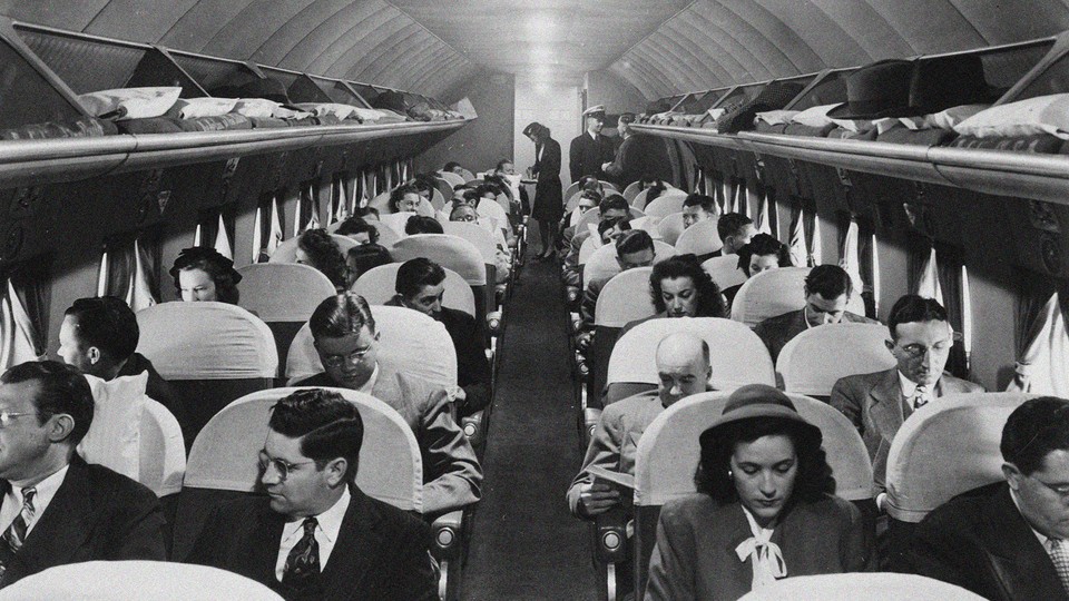 Old photo of people in an airplane