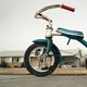 A tricycle in front of a house