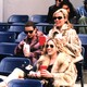 Carrie, Samantha, Miranda, and Charlotte wear sunglasses and watch a baseball game