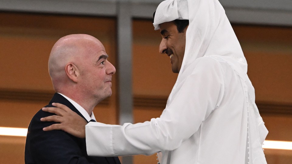 FIFA president Gianni Infantino talks with Qatar Emir Sheikh Tamim bin Hamad Al Thani during a match.