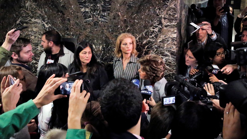 Summer Zervos, a former contestant on The Apprentice, leaves court after a hearing in her defamation case against President Trump on December 5.