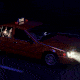 An autonomous yellow taxi cab driving at night on an empty street with a single passenger in the backseat staring at her glowing cellphone