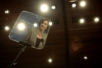 Nancy Pelosi reflected in a teleprompter in 2007