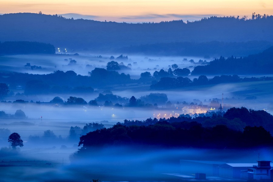 Fog covers a rural German landscape.