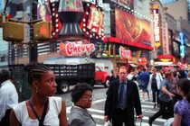 An old photo of Times Square filled with people