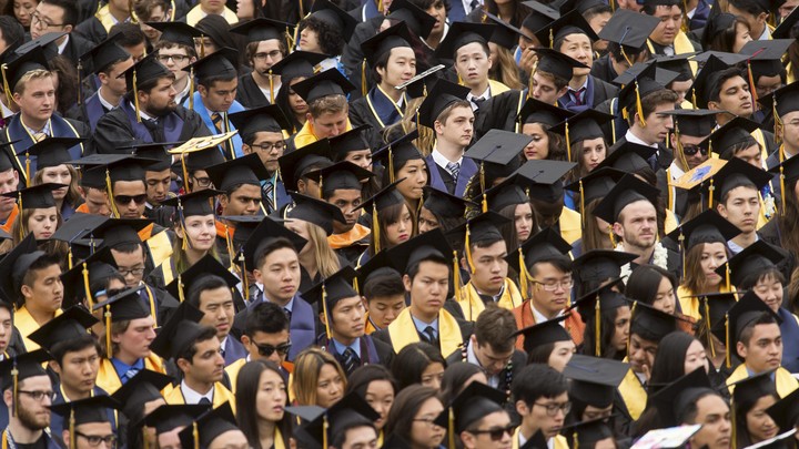 A sea of graduates in caps and gowns