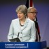 U.K. Prime Minister Theresa May and European Commission President Jean-Claude Juncker address the media at the EU headquarters in Brussels on December 8, 2017. 