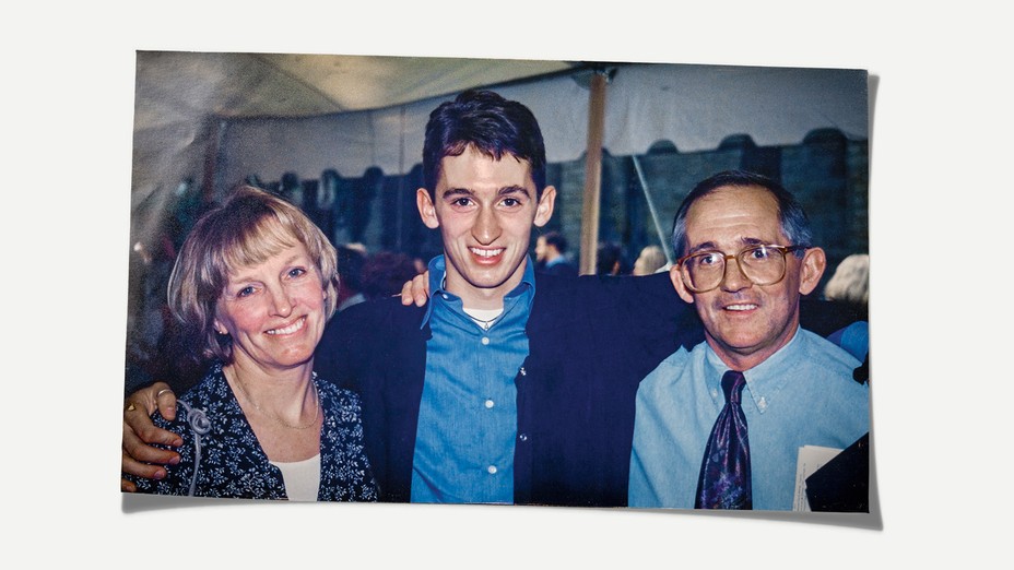 Photo of Helen, Bobby, and Bob Sr. smiling and standing in an outdoor tent at graduation