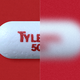 A close-up of a Tylenol pill against a red background. Half the photo is blurred and half is in focus.