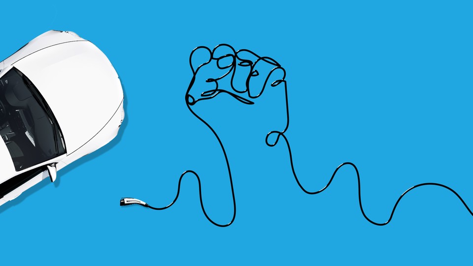 An EV with its charger, which forms a fist