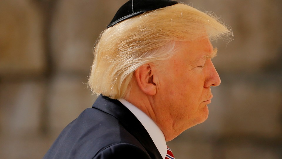 U.S. President Donald Trump prays at the Western Wall in Jerusalem