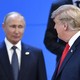 Donald Trump looks at Russia's President Vladimir Putin as they take their places for a family photo during the G20 Leaders' Summit