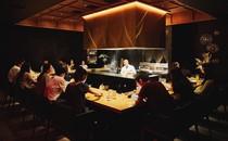 An image of diners sitting inside a full restaurant.