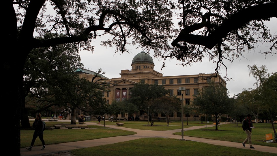 A stately university building is photographed on a slightly overcast day